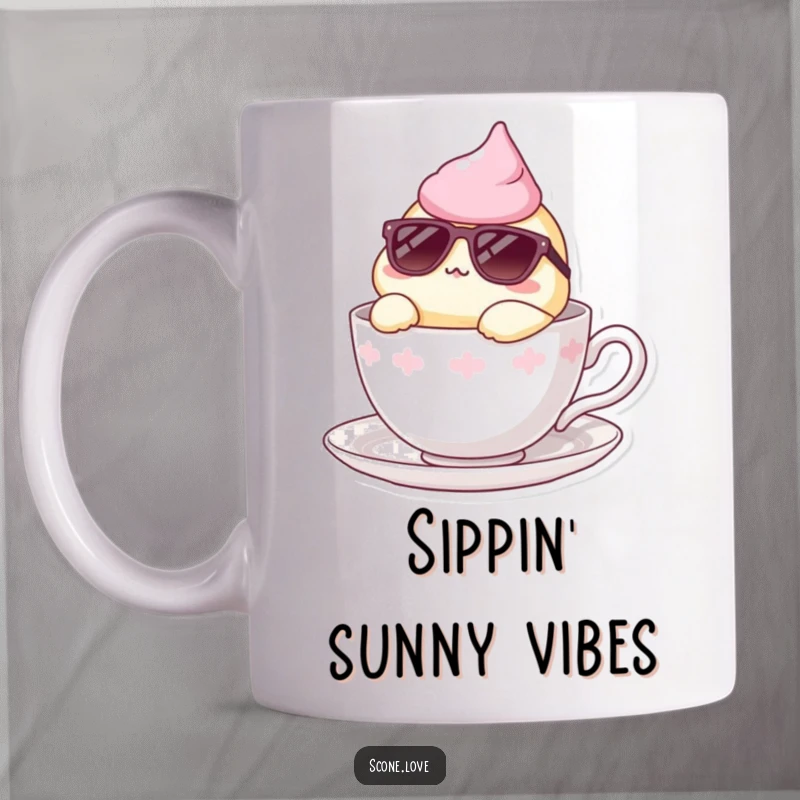 Funny mug showing a scone wearing sunglasses, lounging stylishly inside a teacup, exuding cool relaxation.