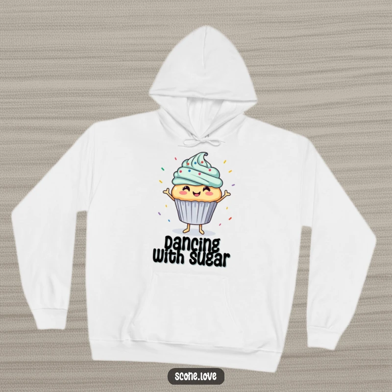 Funny hoodie features a happy cupcake dancing joyfully with sprinkles raining down, a warm and humorous garment for sweet celebrations.