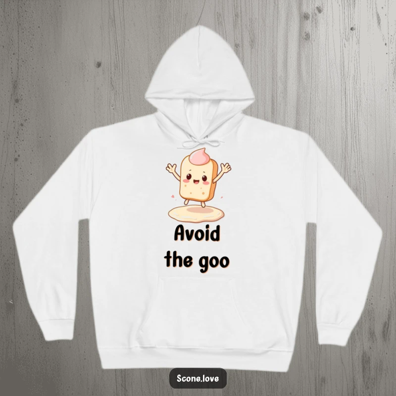 Funny Kawaii Scone Hoodie: a scone leaps over a frosting puddle, waving cheerfully, a funny baker's gift.