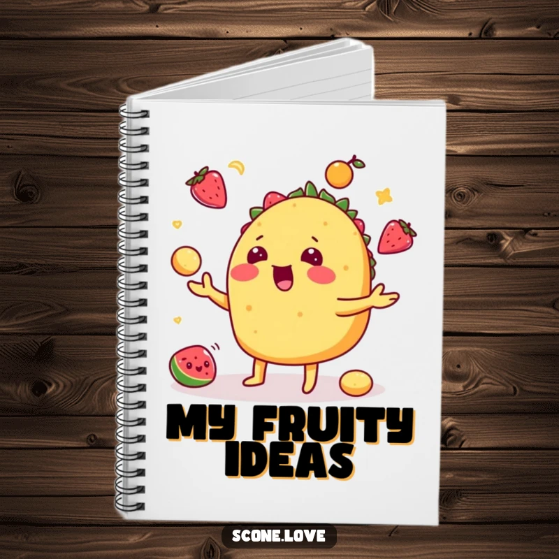 Funny taco notebook with a playful taco juggling fruits cover, perfect for jotting down notes and recipes.